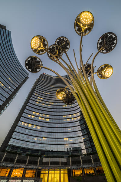 Milan, Lombardy, Italy. Gae Aulenti Square with iconic streetlights. 