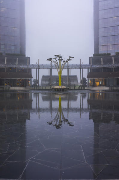 Milan, Lombardy, Italy. Gae Aulenti Square with iconic streetlights. 