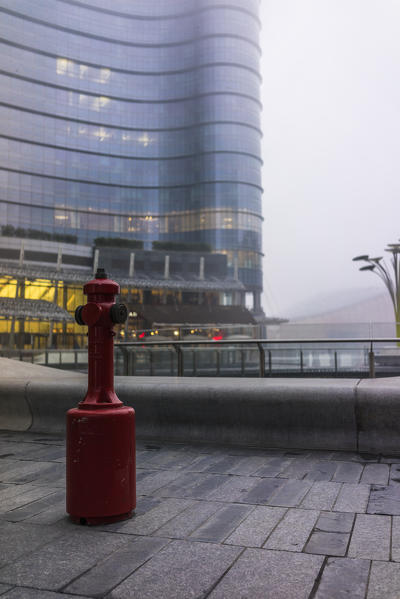 Milan, Lombardy, Italy. A red fire extinguisher. 