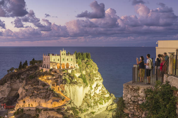 Tropea, Province of Vibo Valentia, Calabria, Italy. The Santa Maria dell'Isola seen from Piazza del Cannone at dusk.