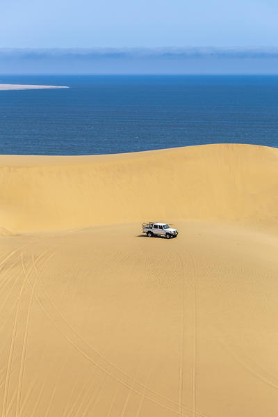 Offroad vehicle on top of the sand dunes,Sandwich Harbour, Namib Naukluft National Park,Namibia,Africa