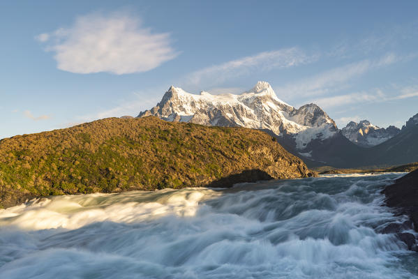 Salto Grande waterfall in the morning with Cerro Paine Grande peaks. Torres del Paine National Park, Ultima Esperanza province, Chile.