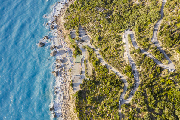 Aerial view of the winding road to Megali Petra beach. Lefkada, Ionian Islands region, Greece.