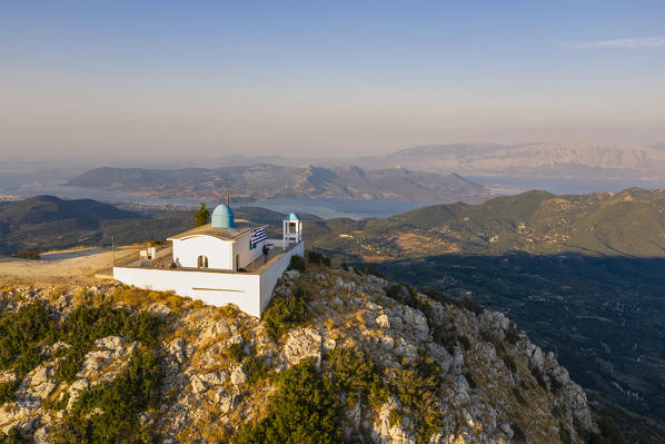 Aerial view of the Orthodox  church of the Prophet Elias at sunset in summer. Lefkada, Ionian Islands region, Greece.