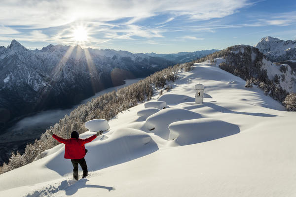 Italy, Italian Alps, Lombardy, The huts and the bell tower of Alpe Cima sorrounded by metres of snow