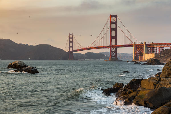 Golden Gate Bridge at sunset shot from Baker Beach. San Francisco, Marin County, California, USA.