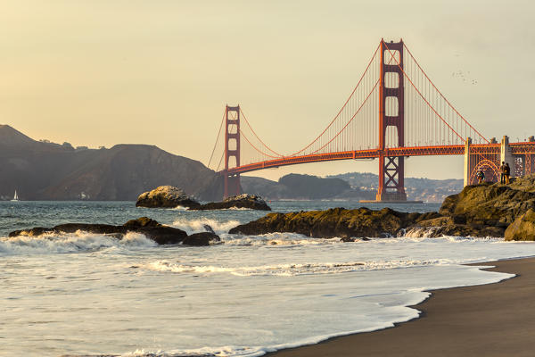 Golden Gate Bridge at sunset shot from Baker Beach. San Francisco, Marin County, California, USA.