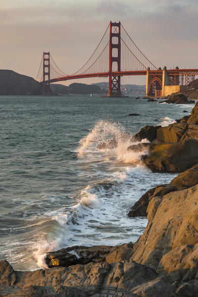 Golden Gate Bridge at sunset shot from Baker Beach. San Francisco, Marin County, California, USA.