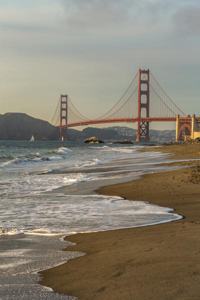 Golden Gate Bridge at sunset shot from Baker Beach. San Francisco, Marin County, California, USA.