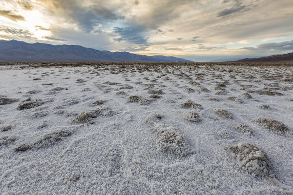 Sunset landscape at Badwater Basin. Death Valley National Park, Inyo County, California, USA.