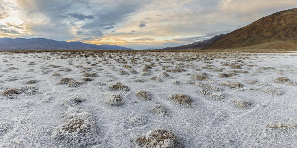 Sunset landscape at Badwater Basin. Death Valley National Park, Inyo County, California, USA.