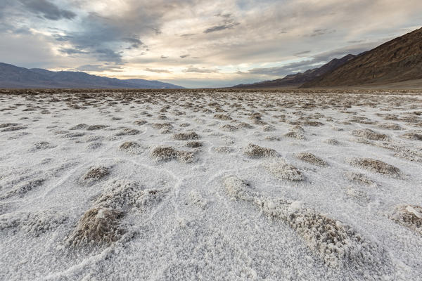 Sunset landscape at Badwater Basin. Death Valley National Park, Inyo County, California, USA.