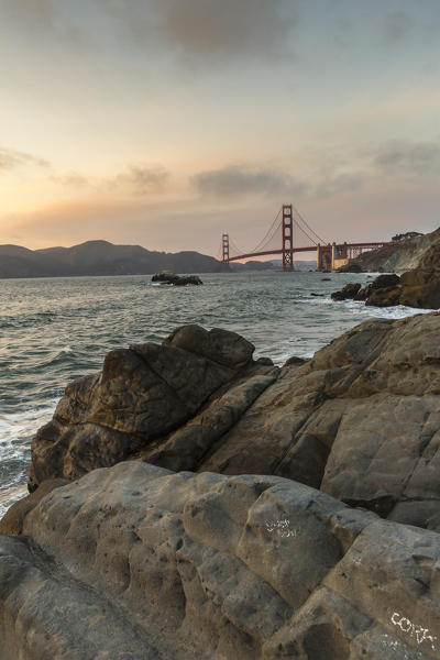 Golden Gate Bridge at sunset shot from Baker Beach. San Francisco, Marin County, California, USA.