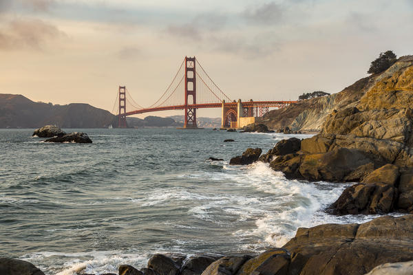 Golden Gate Bridge at sunset shot from Baker Beach. San Francisco, Marin County, California, USA.