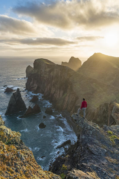 Man admiring the view of  Point of St Lawrence and Furado Point. Canical, Machico district, Madeira region, Portugal. (MR)