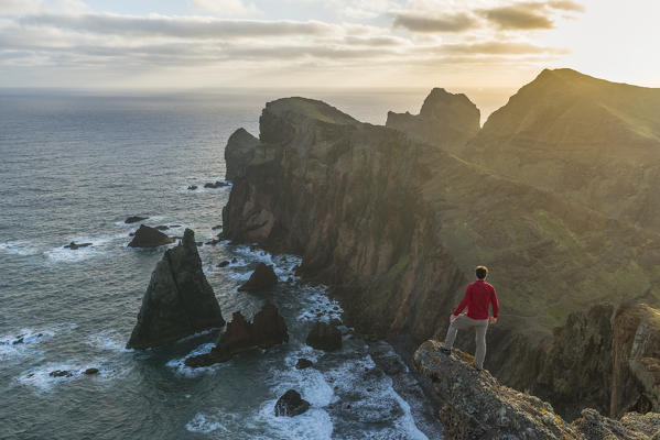 Man admiring the view of  Point of St Lawrence and Furado Point. Canical, Machico district, Madeira region, Portugal. (MR)