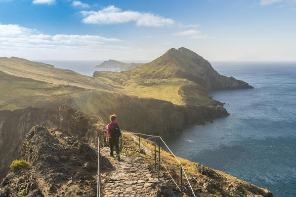 Woman walking on the trail to Point of Saint Lawrence. Canical, Machico district, Madeira region, Portugal.