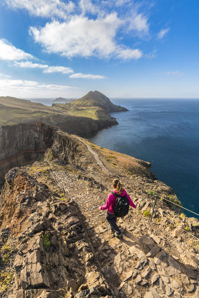 Woman walking on the trail to Point of Saint Lawrence. Canical, Machico district, Madeira region, Portugal.