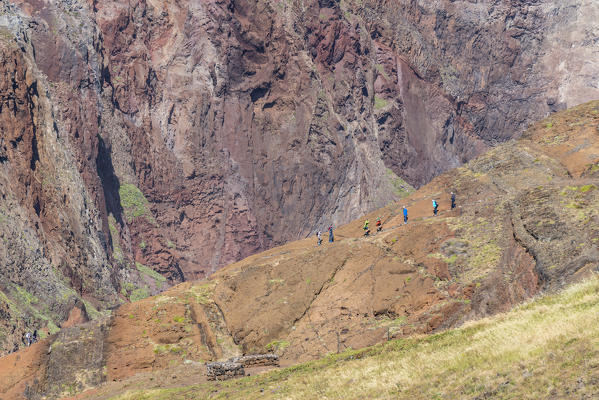 People walking on PR8 trail that leads to Point of St Lawrence. Machico district, Madeira region, Portugal.