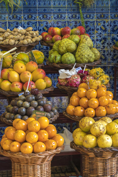 Different varieties of passion fruit and local fruit at Mercado dos Lavradores - Farmers' Market. Funchal, Madeira region, Portugal.