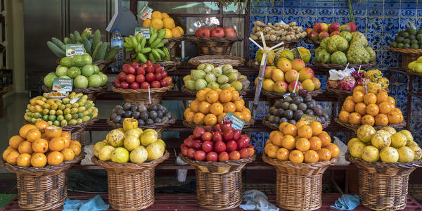 Different varieties of passion fruit and local fruit at Mercado dos Lavradores - Farmers' Market. Funchal, Madeira region, Portugal.