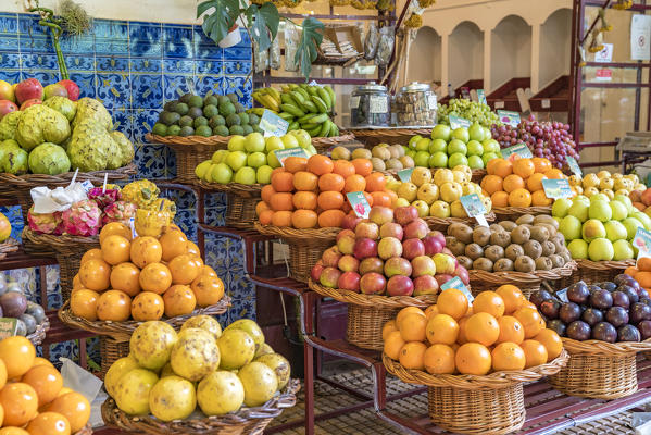 Different varieties of passion fruit and local fruit at Mercado dos Lavradores - Farmers' Market. Funchal, Madeira region, Portugal.