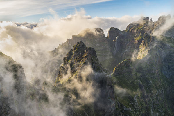 Mist on the peaks from Vereda do Areeiro. Pico do Arieiro, Funchal, Madeira region, Portugal.