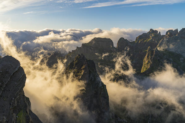 Mist on the peaks from Vereda do Areeiro. Pico do Arieiro, Funchal, Madeira region, Portugal.