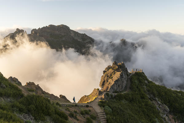 Hiker walking on the trail towards Nino da Manta platform lookout. Pico do Arieiro, Funchal, Madeira region, Portugal. (MR)