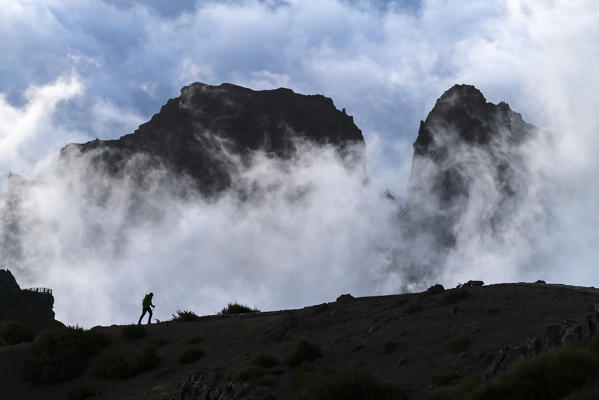 Silhouette of a hiker on Vereda do Areeiro. Pico do Arieiro, Funchal, Madeira region, Portugal.