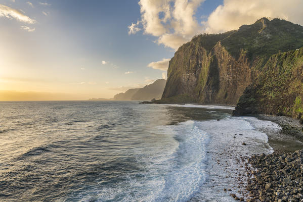 Cliffs and waves on Faial beach at dawn. Faial, Santana municipality, Madeira region, Portugal.