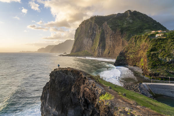 Man taking pictures at dawn. Faial, Santana municipality, Madeira region, Portugal.