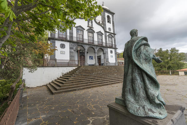 The statue of Emperor Charles I of Austria and the church of Nossa Senhora do Monte. Funchal, Madeira region, Portugal.