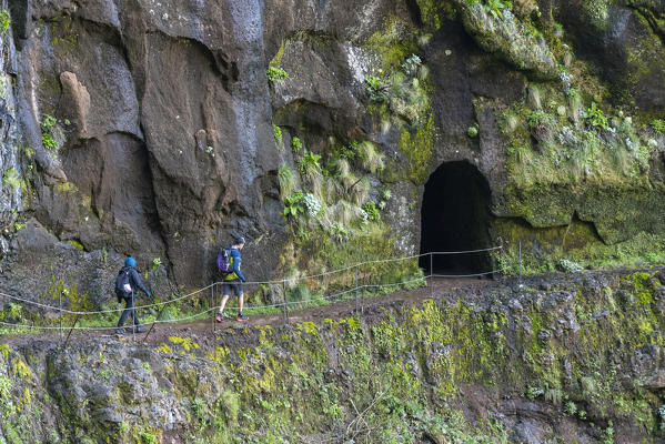 People walking on the trail from Pico Ruivo to Pico do Areeiro. Santana, Madeira region, Portugal.