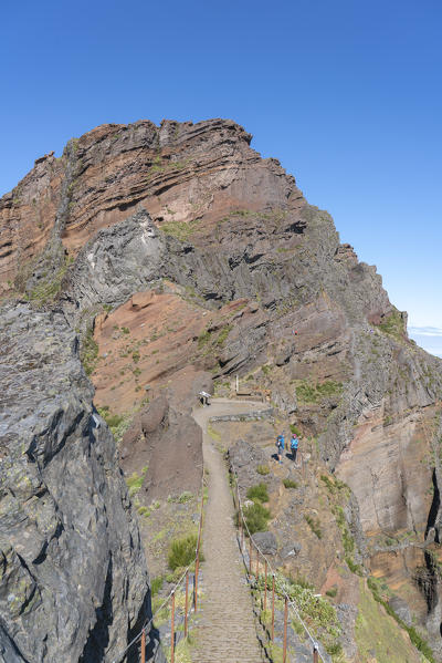 People on the trail from Pico Ruivo to Pico do Areeiro. Funchal, Madeira region, Portugal.