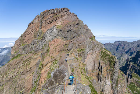 People on the trail from Pico Ruivo to Pico do Areeiro. Funchal, Madeira region, Portugal.