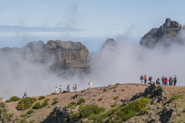 People walking on the trail at Pico do Areeiro. Funchal, Madeira region, Portugal.