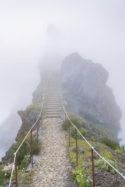 Staircase in the mist on the trail at Pico do Areeiro. Funchal, Madeira region, Portugal.