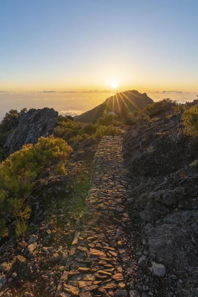 Sunrise over the clouds on the trail to Pico Ruivo. Achada do Teixeira, Santana municipality, Madeira region, Portugal.