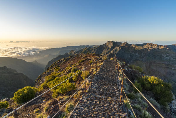 The trail from the top of Pico Ruivo with Pico do Areeiro in the background. Achada do Teixeira, Santana municipality, Madeira region, Portugal.