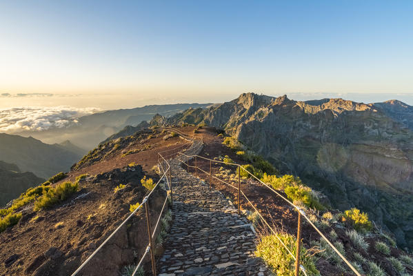 The trail from the top of Pico Ruivo with Pico do Areeiro in the background. Achada do Teixeira, Santana municipality, Madeira region, Portugal.