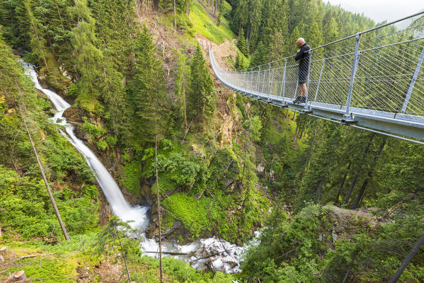 Waterfall Ragaiolo and Tibetan bridge, Rabbi valley, district of Trento,Trentino Alto Adige; Italy; Europe; Stelvio national park