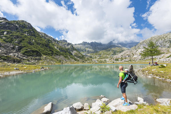 Tourist to the lower Cornisello lake
Europe, Italy, Trentino region, Nambrone valley, Rendena valley, Carisolo, Sant'Antonio di Mavignola, Madonna di Campiglio