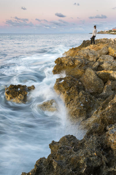 Photographer looking at the sea
Europe, Sicily region, Palermo district, Island of the females