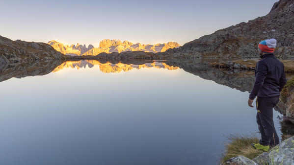 A hiker admires the sunset on Brenta Dolomites
Europe, Italy, Trentino, Nambrone Valley, Sant'Antonio di Mavignola, Madonna di Campiglio