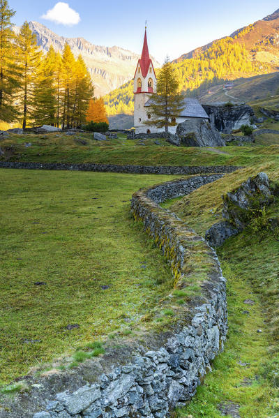 Aurina valley and Santo Spirito church in autumn
Europe, Italy, South Tyrol, Aurina valley, Bolzano province, Predoi municipality, Casere