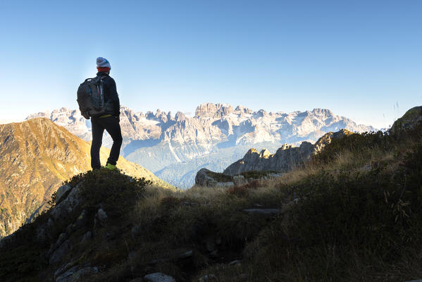 Tourist admiring Natural Park Adamello Brenta
Europe, Italy, Trentino, Sant'Antonio di Mavignola, Trento province, Rendena valley
