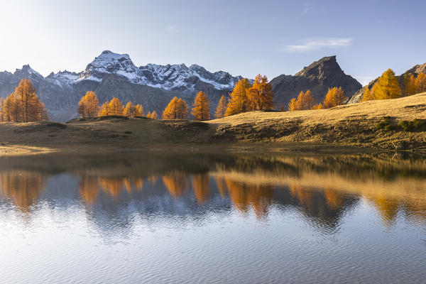 Autumnal view at sunset of the mountains surrounding Alpe Devero from the Laghi del Sangiatto. Antigorio valley, Piedmont, Italy.