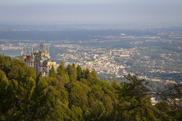 View of the abandoned Grand Hotel Campo dei Fiori watching over Varese city at sunset. Campo dei Fiori, Varese, Parco Campo dei Fiori, Lombardy, Italy.