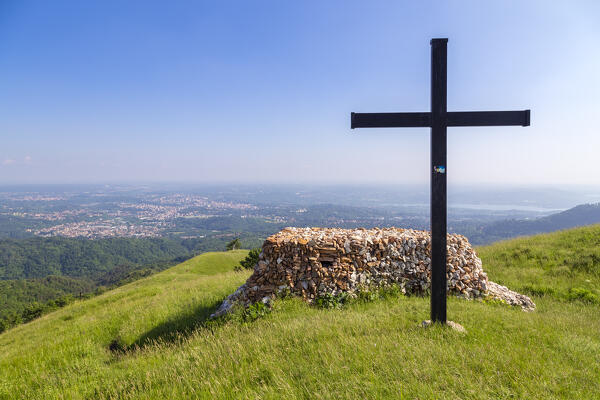 View of the top of Monte Chiusarella with the cross and rocks altair, varesine prealps, Parco Regionale del Campo dei Fiori, Varese district, Lombardy, Italy.